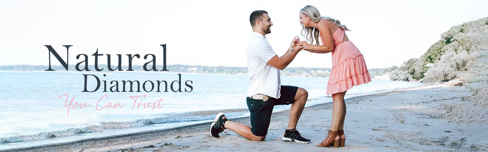 Natural Diamonds You Can trust - text overlaying an image of a man proposing to a woman on the beach