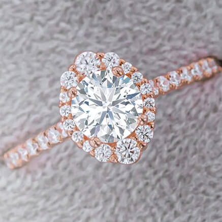 close up of diamond and rose gold engagement ring